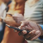 Close up of hands using smartphone